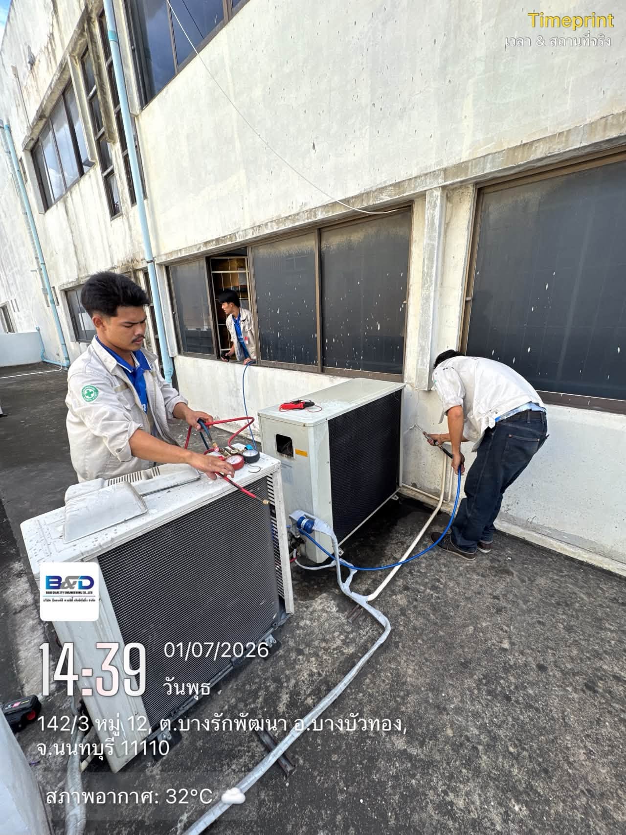 Technician installing a wall-type air conditioner indoors